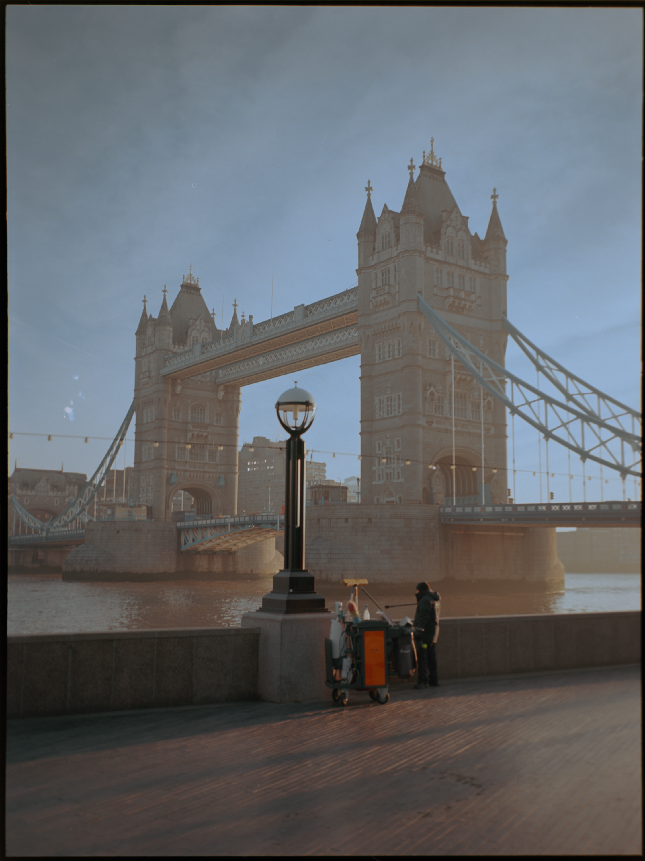 Tower Bridge with street workers on the south bank boardwalk — early morning medium format street photography