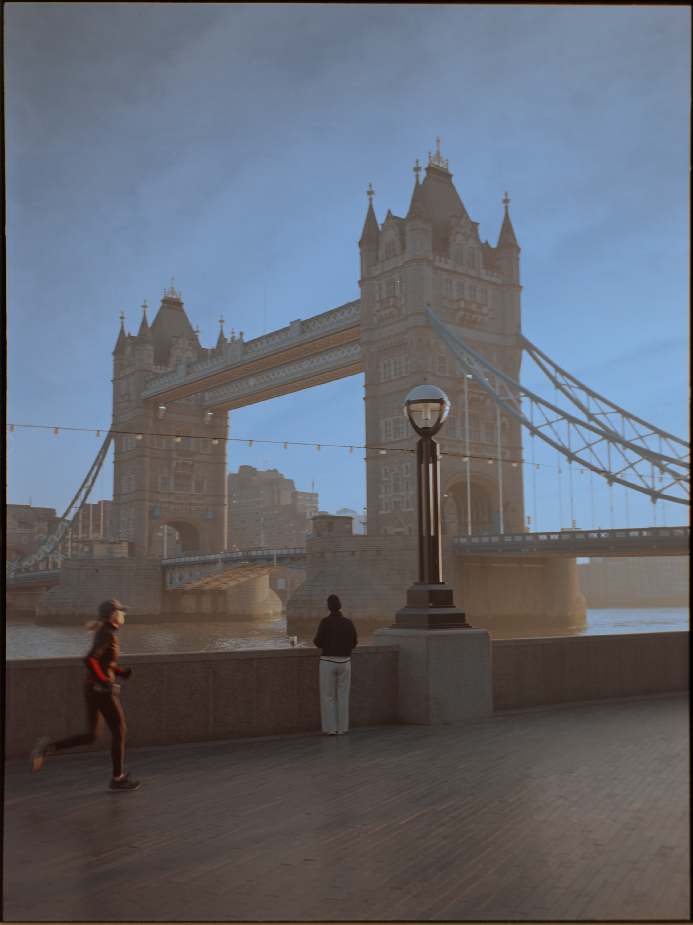 Runner and bystander on the south bank with Tower Bridge behind — Ektar 100 film photography London