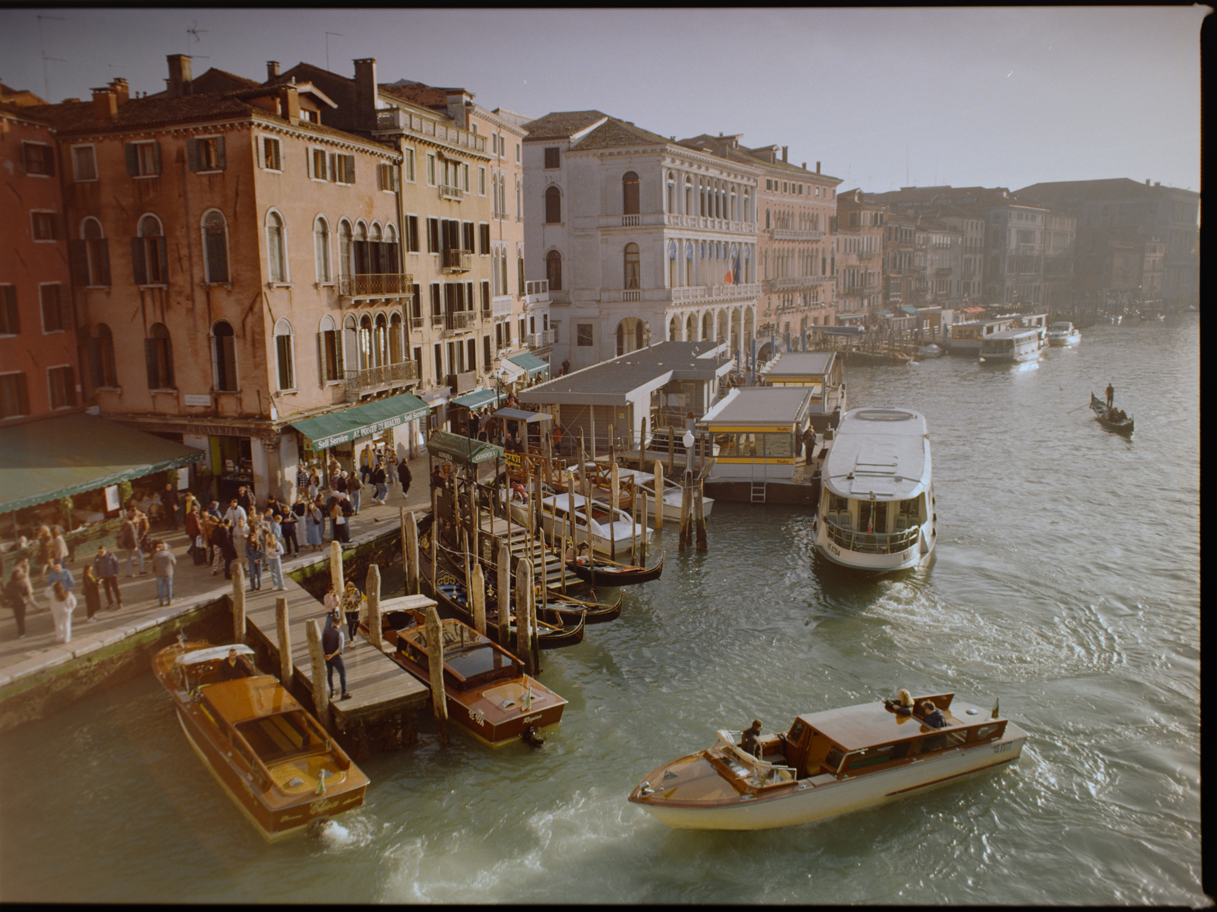 Wide elevated shot from the Rialto Bridge looking down the Grand Canal with boats — Venice on Gold 200