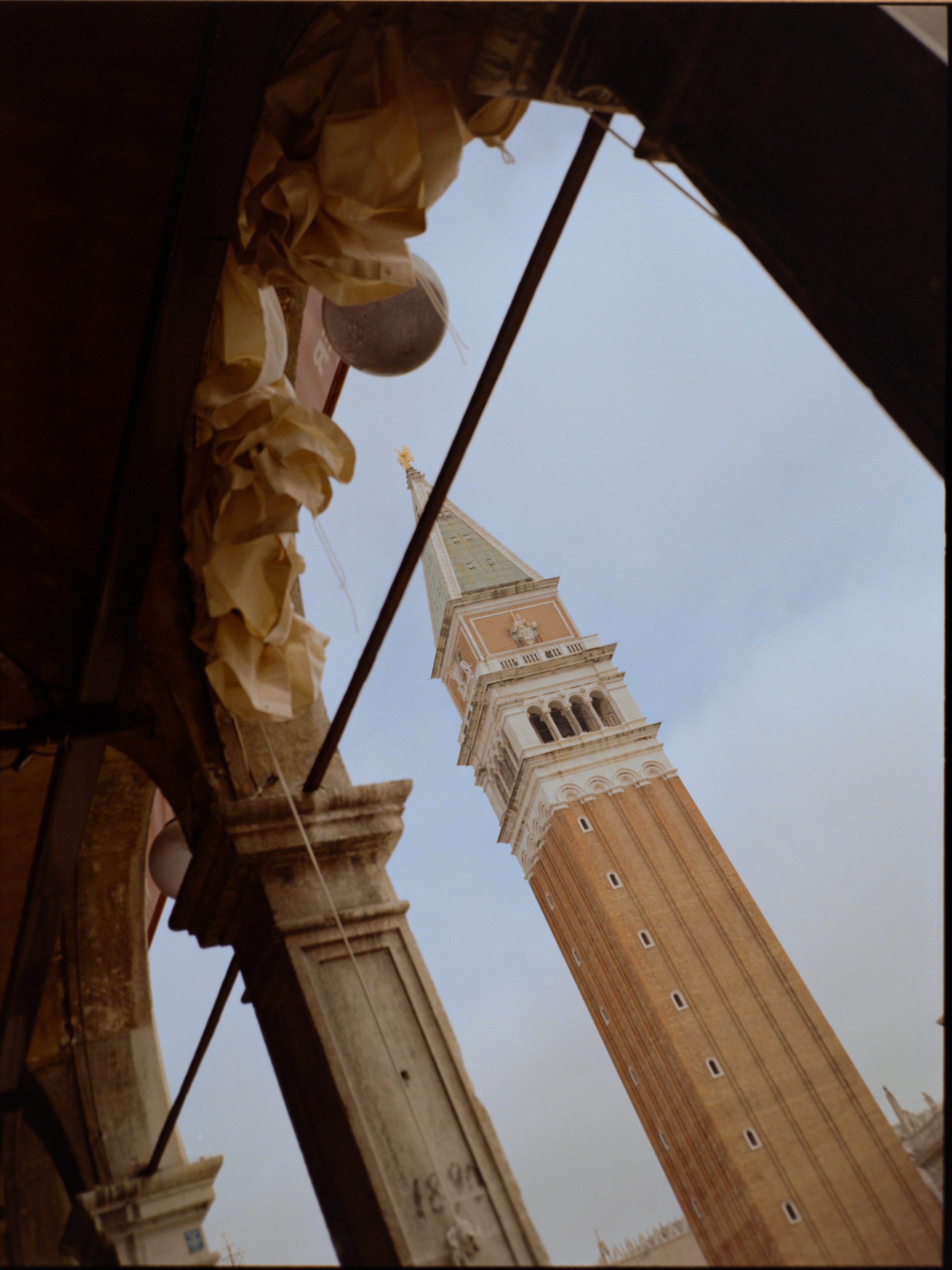 The Campanile framed through an archway of the arcade — dramatic perspective on Kodak Ektar 100