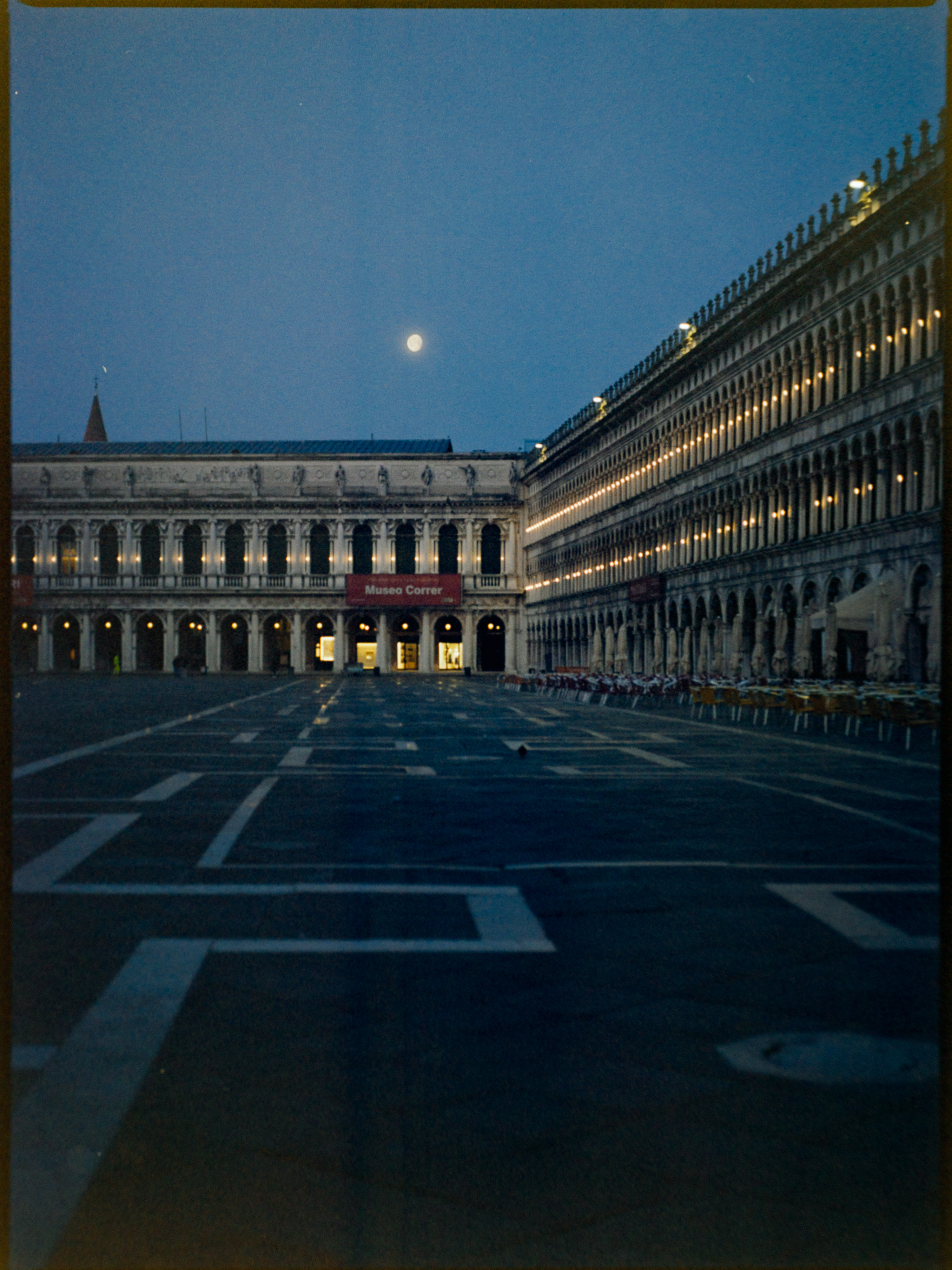 St Marco's Square at blue hour, nearly empty with the Museo Correr illuminated and moon overhead — Kodak Ektar 100