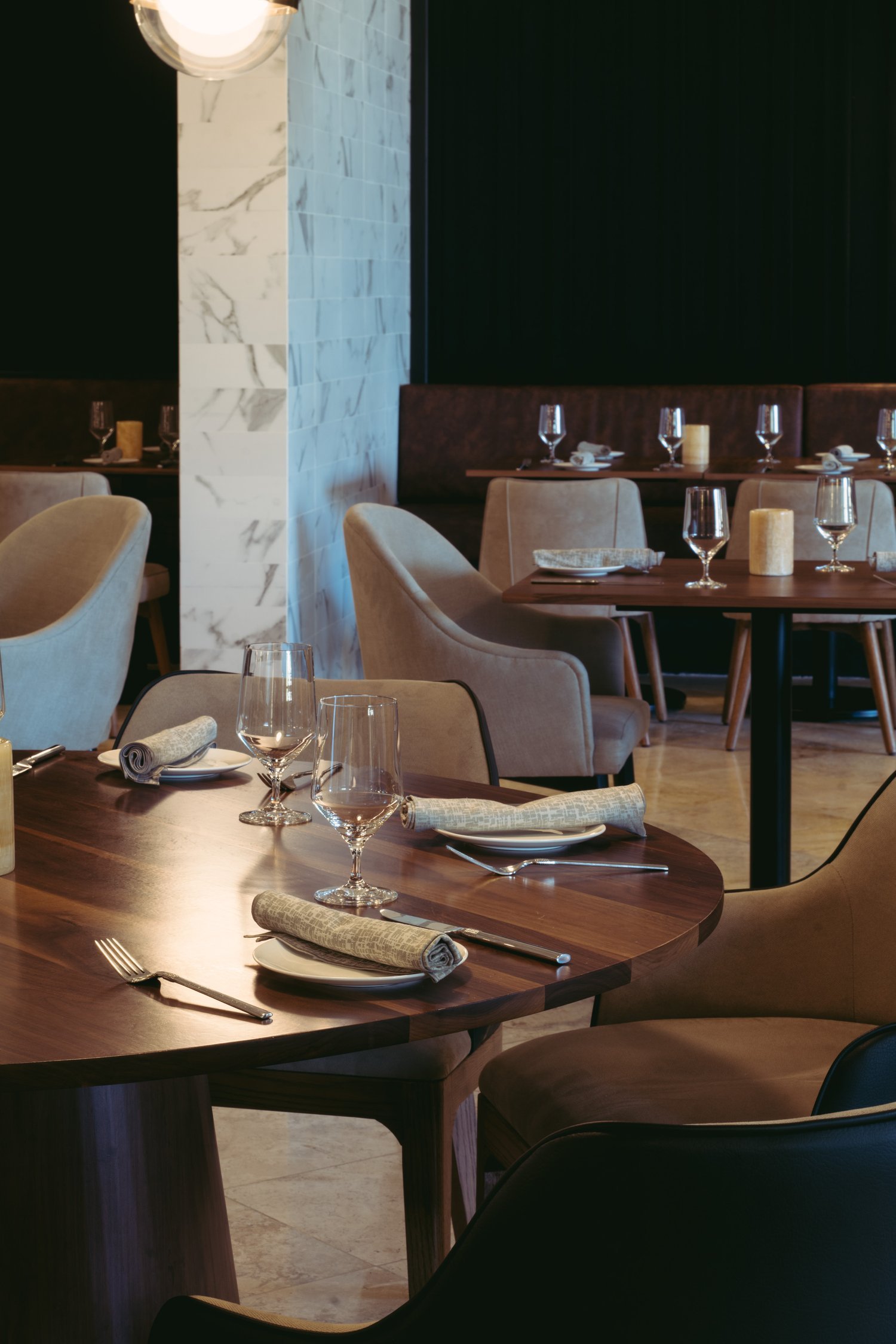Luxury hotel restaurant table setting moody lighting