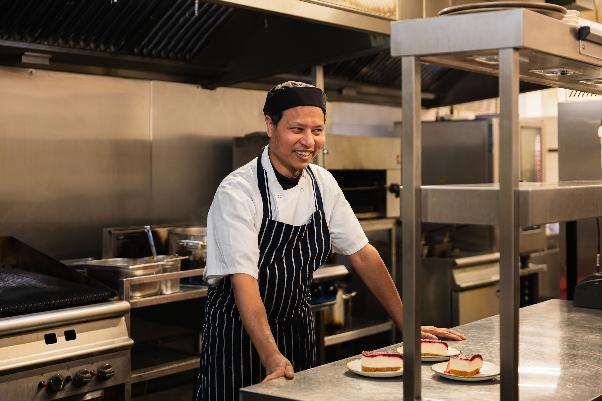 Hotel reception staff candid portrait London