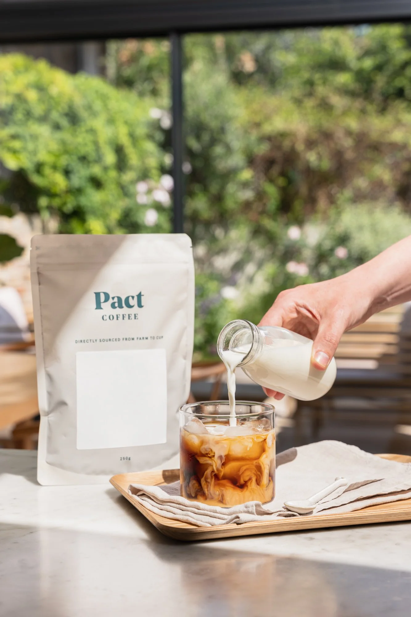 Pact Coffee product on white photography